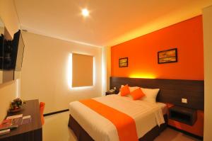 Postel nebo postele na pokoji v ubytování Pratama Hotel & Convention Mataram