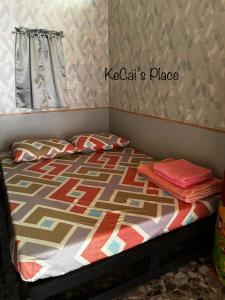 Ένα ή περισσότερα κρεβάτια σε δωμάτιο στο KeCai’s Place