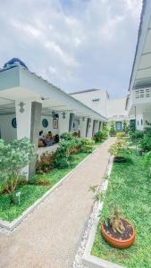 a building with a pathway in front of it at CERIA HOTEL at Alun Alun Yogyakarta in Yogyakarta