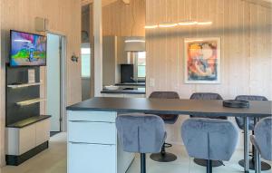 a kitchen with a large table and chairs at Friedrichskoog-Strandpark 15 in Friedrichskoog