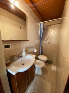 a bathroom with a sink and a toilet at Home Sweet Home rooms in Bari