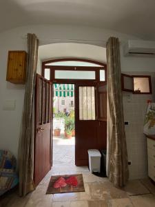an open door to a room with a door sidx sidx at Home Sweet Home rooms in Bari