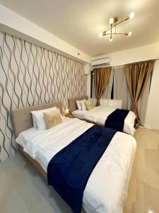 Katil atau katil-katil dalam bilik di M&M Condostay at Shore 2 Residences Tower 2 Pasay City