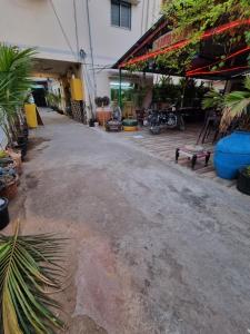 an empty parking lot in front of a building at Dream Vision Guest House in Diu