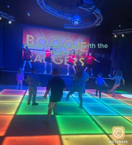a group of people dancing on a lighted dance floor at Robin hood Caravan park North Wales Free Wi-Fi and Smart TVs Passes not included in Rhyl