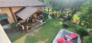 an aerial view of a house with a yard at Sumatra Cheeky Monkeys in Bukit Lawang