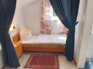a small bedroom with a bed and a window at Holiday home in Bad Mitterndorf - Steiermark 41125 in Bad Mitterndorf