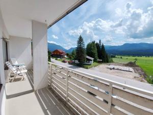 a balcony with a view of the mountains at Apartment in Sonnenalm - Salzkammergut 37018 in Reith