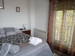 A bed or beds in a room at Bella vista
