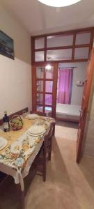 a dining room with a table with plates on it at Studio in Karbuni - Insel Korcula 6384 in Brnistrova