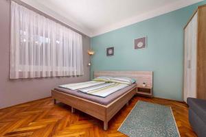 a bedroom with a bed in a room at Holiday home in Balatonmariafürdo 40848 in Balatonmáriafürdő