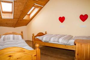 A bed or beds in a room at Holiday home in Balatonmariafürdo 37749