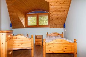 A bed or beds in a room at Holiday home in Balatonmariafürdo 37749