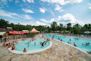 a group of people in a pool at a resort at Mobilehomes in Pieve Vecchia - Norditalienische Seen 22044 in Manerba del Garda