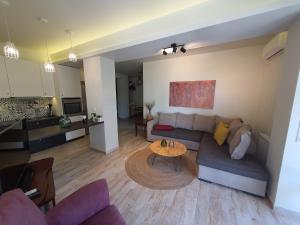 a living room with a couch and a table at KLADIS HOME in Akrotiri