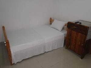 מיטה או מיטות בחדר ב-MEDINA HOTEL - Mutsamudu