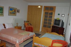 Ένα ή περισσότερα κρεβάτια σε δωμάτιο στο Elati Apartments 