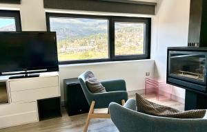 TV a/nebo společenská místnost v ubytování Luces del Poniente