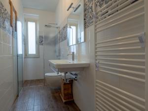 a bathroom with a sink and a toilet at OASI DA VINCI in Tignale