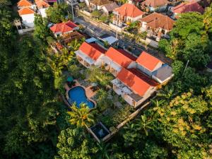 an overhead view of a house with a swimming pool at Arunika Cottage in Nusa Penida