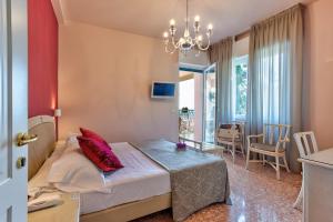 Postel nebo postele na pokoji v ubytování Hotel Villa Europa