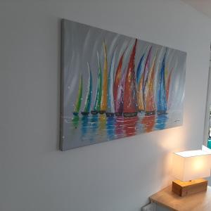 a painting of surfboards hanging on a wall at Seestern in Grömitz