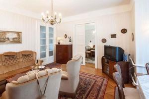 a living room with a couch and a tv at Holiday home in Budapest 34304 in Budapest