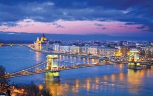 a bridge over a river with a city at night at Holiday home in Budapest 34304 in Budapest
