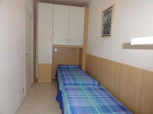 A bed or beds in a room at Apartment in Bibione 38289