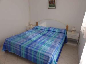 A bed or beds in a room at Apartment in Bibione 38289