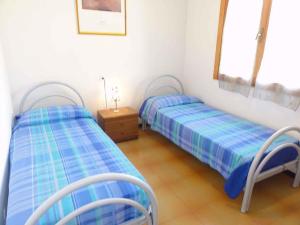A bed or beds in a room at Holiday home in Bibione 36388 Még 16 kép