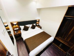 Postel nebo postele na pokoji v ubytování Hotel Hilton Suites