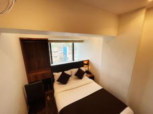Postel nebo postele na pokoji v ubytování Hotel Hilton Suites