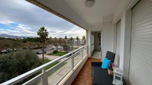 a balcony with a view of a street at Playa Huelin Apartamento in Málaga