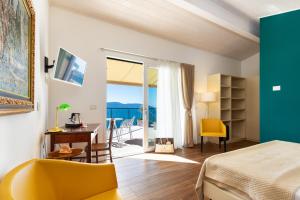 Postel nebo postele na pokoji v ubytování Hotel Villa Europa + 37 fotografií
