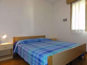 A bed or beds in a room at Apartment in Bibione 38315