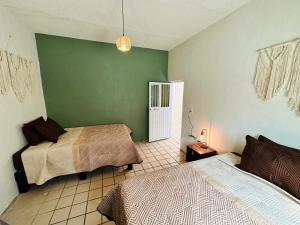 Postel nebo postele na pokoji v ubytování Casa Valentía