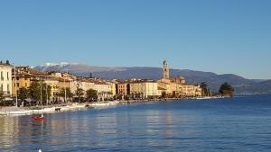 a town on the shore of a body of water at La Casa Sul Lago in Salò