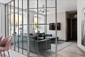 a living room with a large glass wall at Villa S:t Hans in Visby