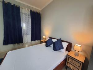 Ліжко або ліжка в номері Spacious Holiday Let Wi-Fi & Private Amenities Oyibi
