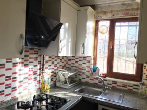 a kitchen with a sink and a window at location İstanbul in Istanbul