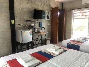 Postel nebo postele na pokoji v ubytování SolarCell Private Homestay - โซล่าเซลล์ไพรเวทโฮมสเตย์