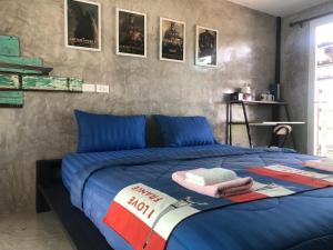 Postel nebo postele na pokoji v ubytování SolarCell Private Homestay - โซล่าเซลล์ไพรเวทโฮมสเตย์