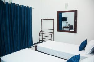 Postel nebo postele na pokoji v ubytování Ayubowan Homestay Katunayake