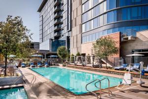 a swimming pool in front of a building at Hotel Nia, Autograph Collection in Menlo Park