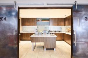 a large kitchen with a island in the middle at Residence Inn by Marriott Dallas Downtown in Dallas
