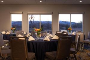 a conference room with tables and chairs and windows at TownePlace Suites by Marriott Ellensburg in Ellensburg