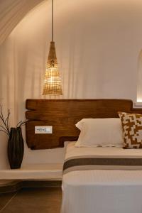 Voodi või voodid majutusasutuse Allure Breeze Suites toas