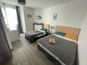 Postel nebo postele na pokoji v ubytování Gîte:"sur le chemin"