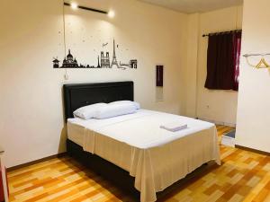 Voodi või voodid majutusasutuse IVI Hotel toas